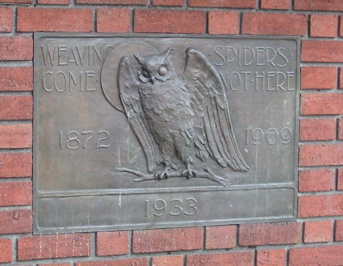 The club motto, carved in relief: *Weaving Spiders Come Not Here.* Leave your business at the gate. (photo: Binksternet)