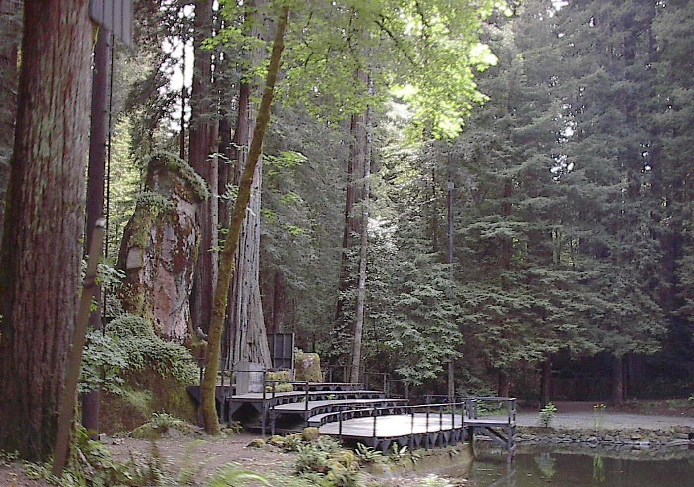 The Owl Shrine at the head of the lake — the actual forty-foot concrete owl the whole ceremony is staged around. It has stood here since the late 1920s. (photo: Aarkwilde, CC BY-SA 3.0)