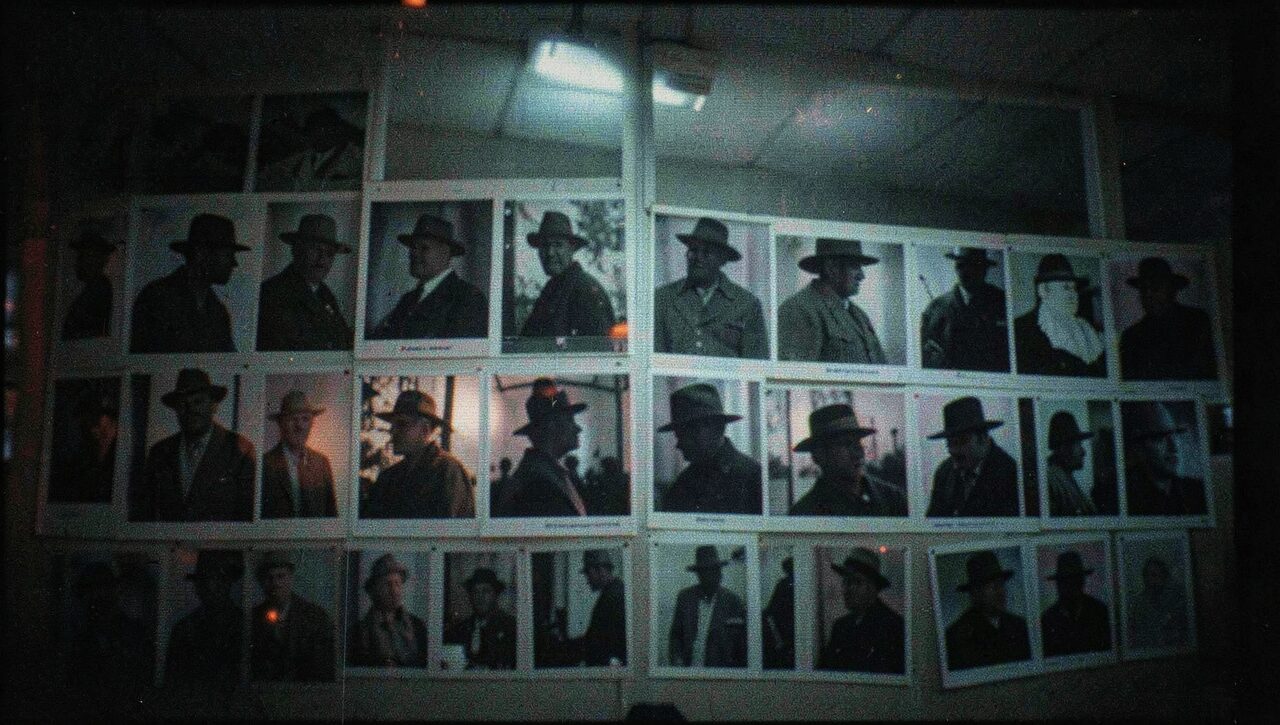 A wall of witness silhouettes, all wearing the same hat. The drawings come from different hands. The hat does not change.