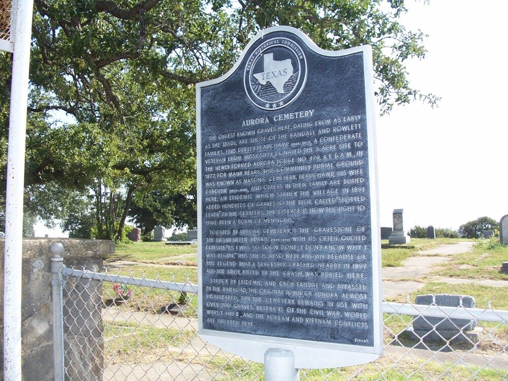 The Texas historical marker at Aurora cemetery, which records the town's decline and, in passing, the airship.