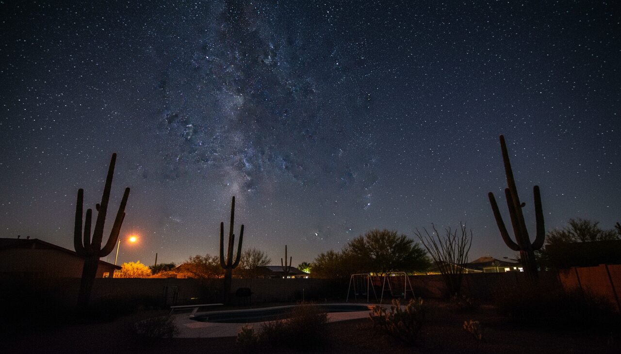 A backyard in the Sonoran Desert, looking up. Clear skies, low humidity, and a sky with nothing in it yet.