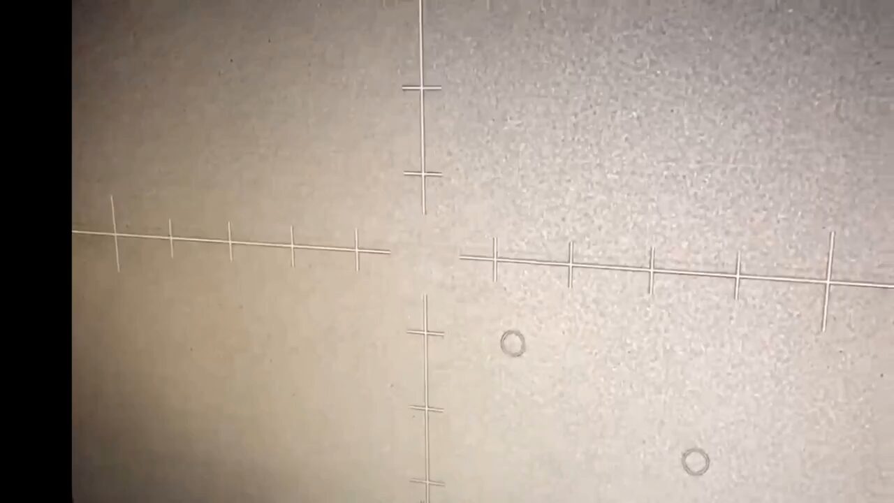 A frame from the declassified Gulf of Oman footage — infrared, filmed on a phone held up to a sensor display.